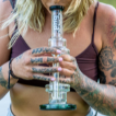 Woman smoking percolator glass bong