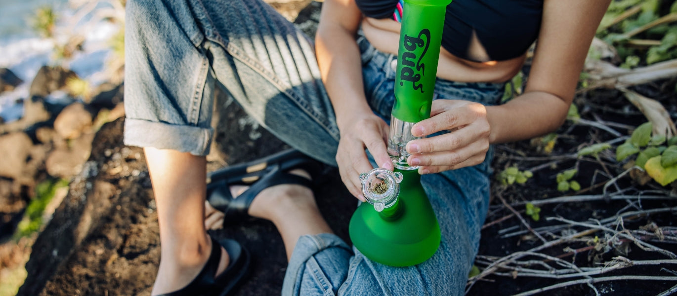 Woman with a cone piece packed with cannabis