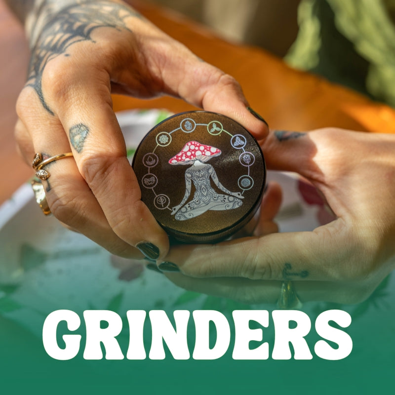 Two hands holding weed grinder