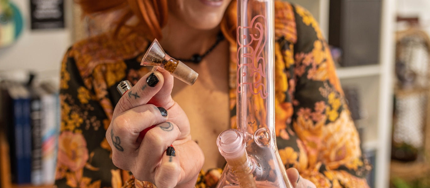 Woman holding a funnel glass cone piece