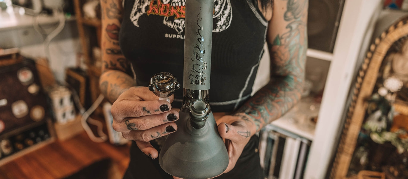 Woman Holding A Teal Glass Cone Piece