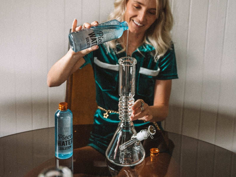 Woman Pouring Piece Water Solution Into Bong