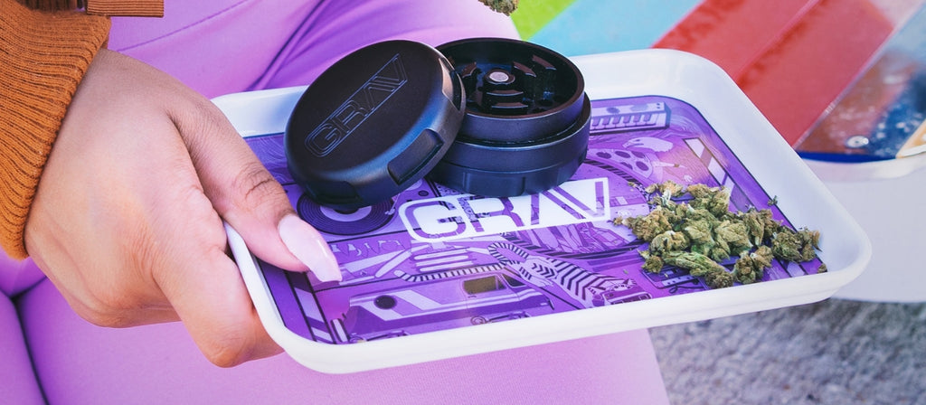 A GRAV grinder on a rolling tray