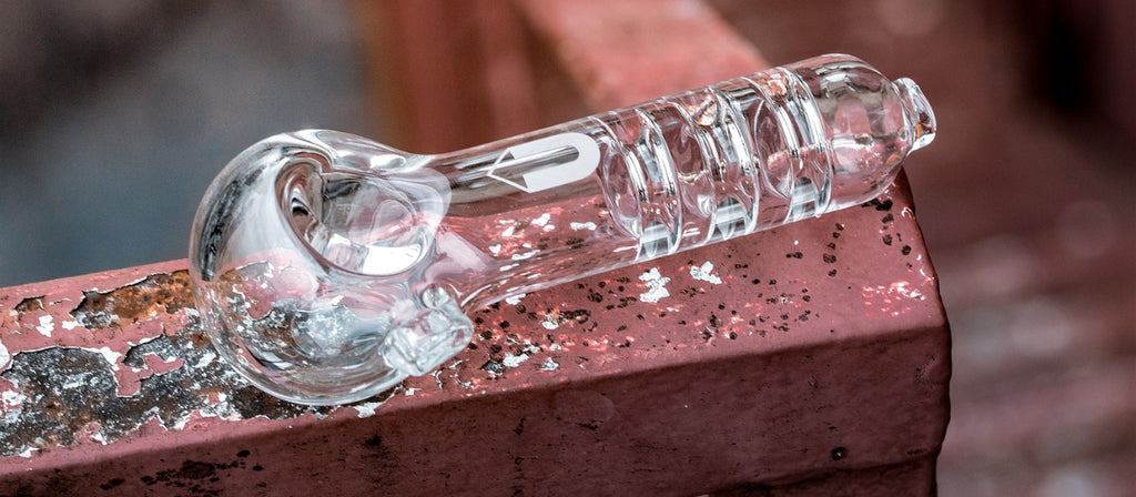 A clear glass spoon pipe