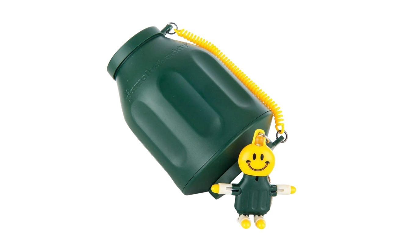 A green Original Smoke Buddy Personal Air Filter and keychain