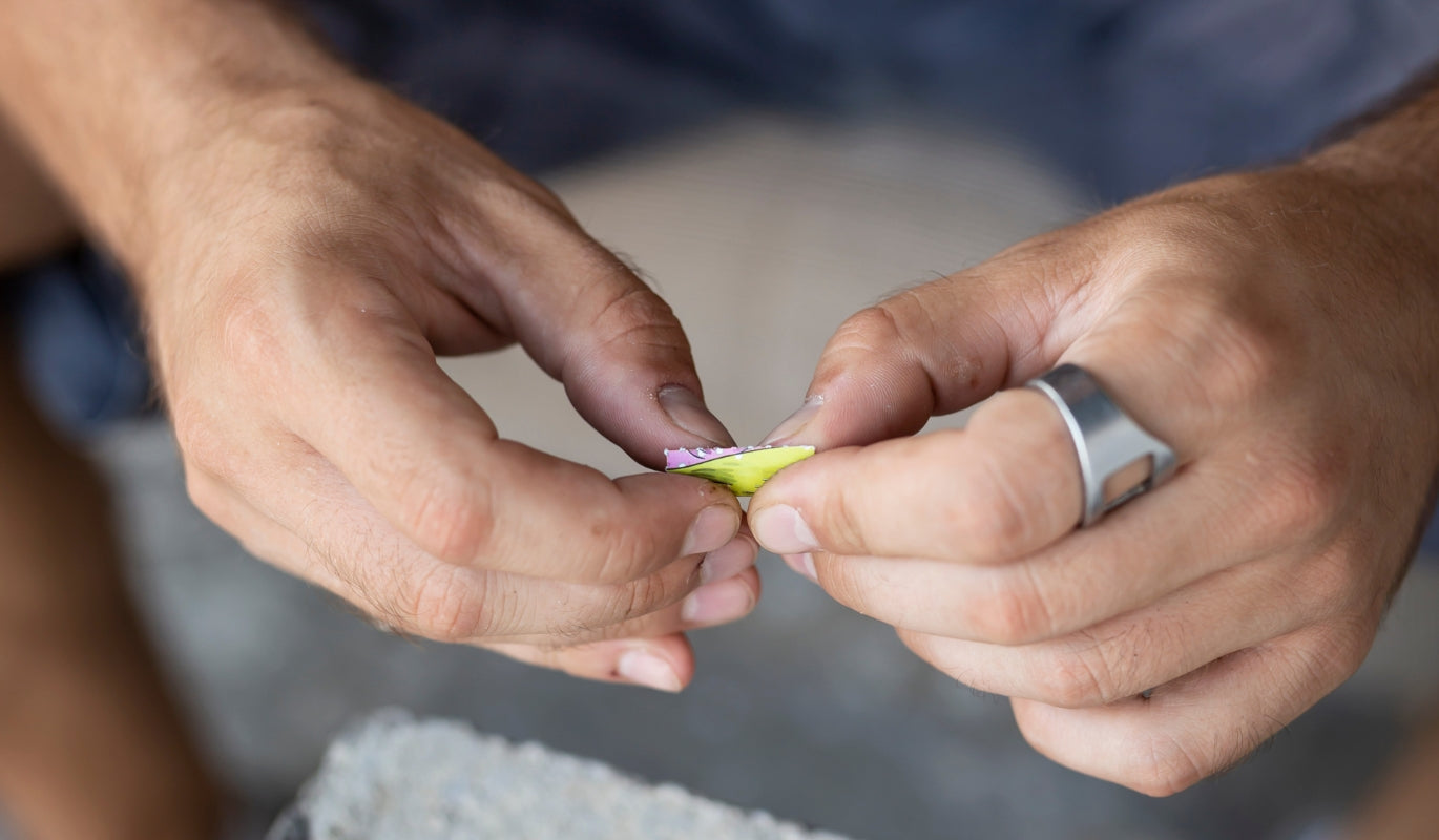 A person creating a joint filter tip