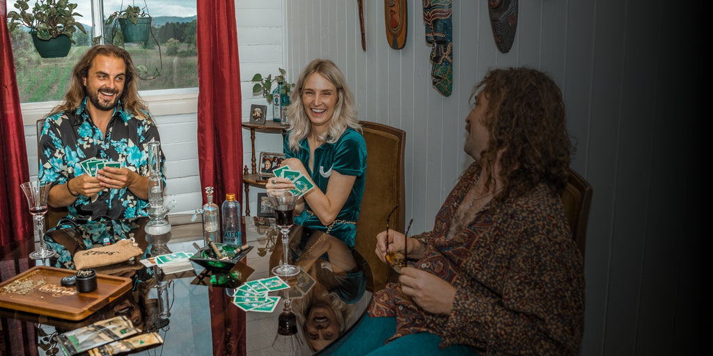 Group of friends smoking around a dinner table