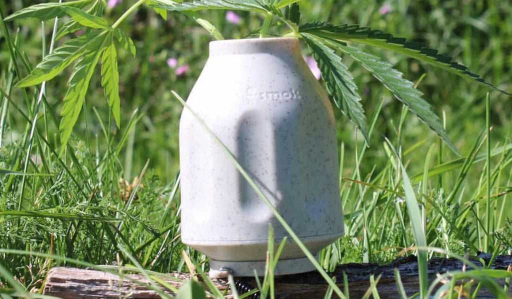 An ECO Smoke Buddy Personal Air Filter in the grass