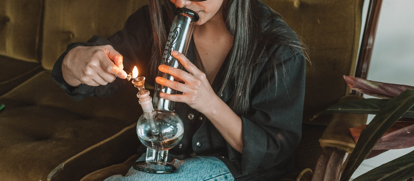 Bong water in a round base glass bong
