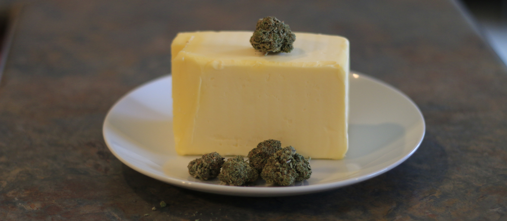 Block of butter with cannabis buds