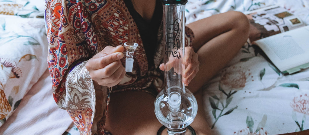 Woman showing off a clear funnel glass cone piece