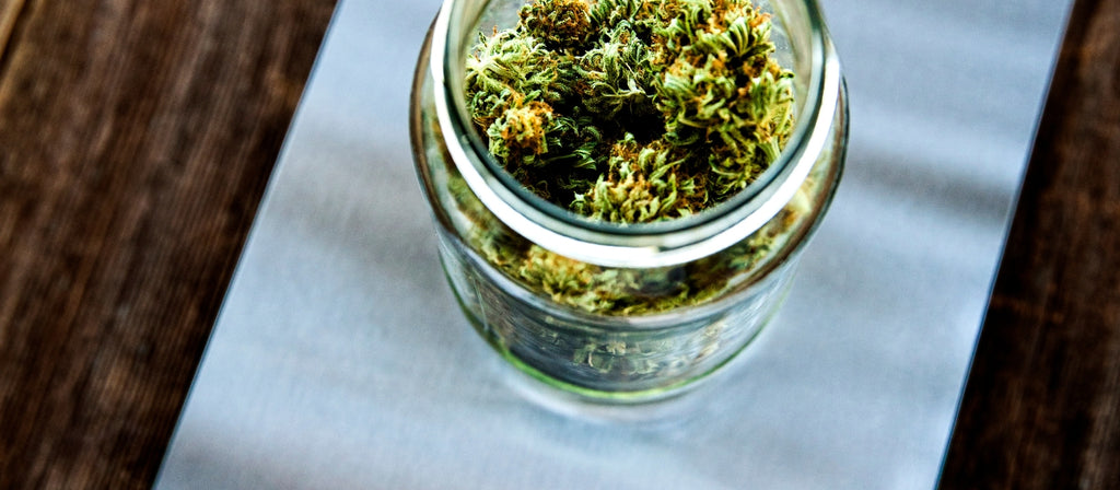 Jar of cannabis on a digital scale