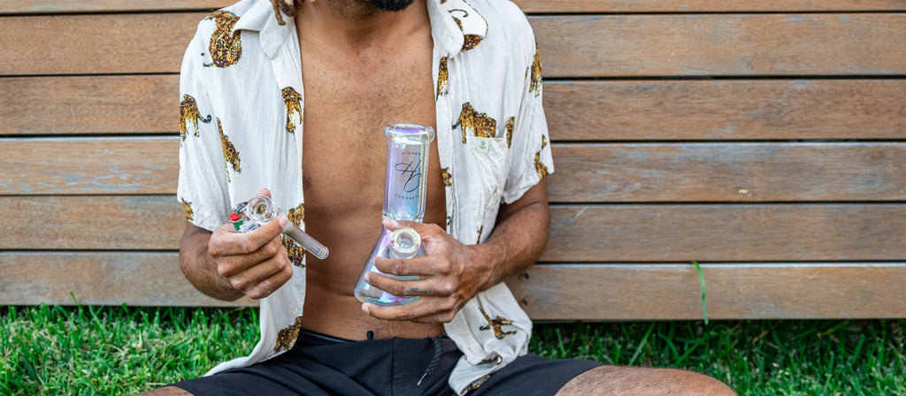 Man holding a Higher Concepts Heavy Duty Beaker Bong