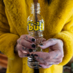 Person holding glass Bud Bottle Bong