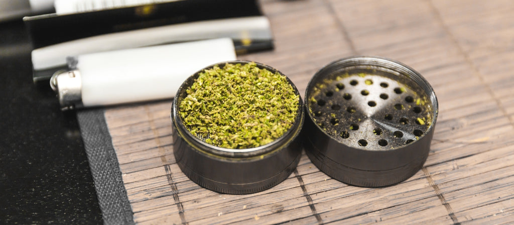 Stainless steel weed grinder with ground cannabis