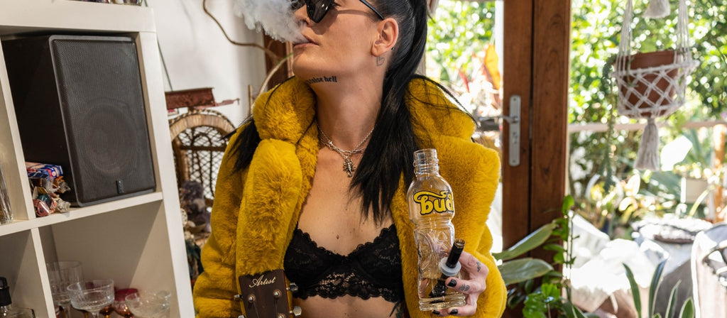 Woman Exhaling Smoke From Bud Bottle Bong 23cm