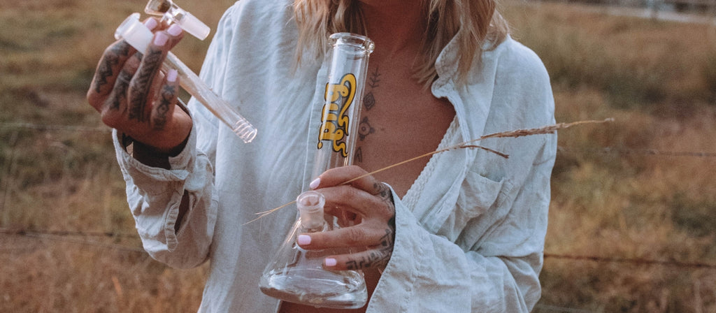Woman holding a Bud Beaker Bong 25cm