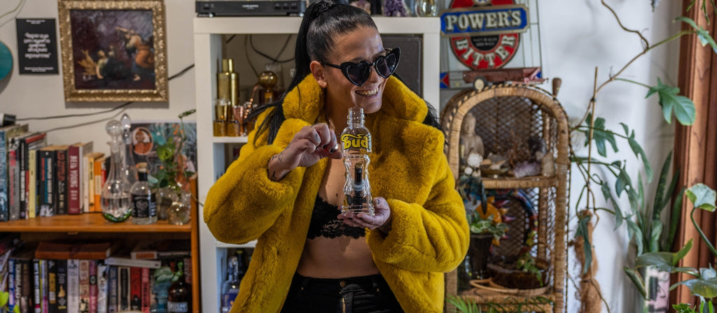 Woman Lighting Up A Bud Bottle Bong 23cm