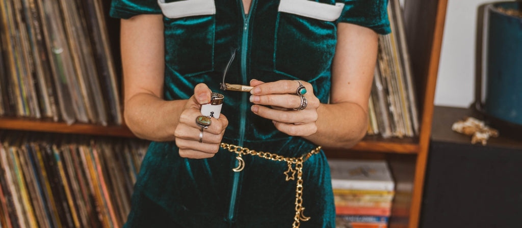 Woman lighting a pre-rolled cone