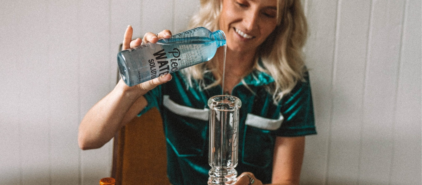 Woman pouring Piece Water Solution into a bong
