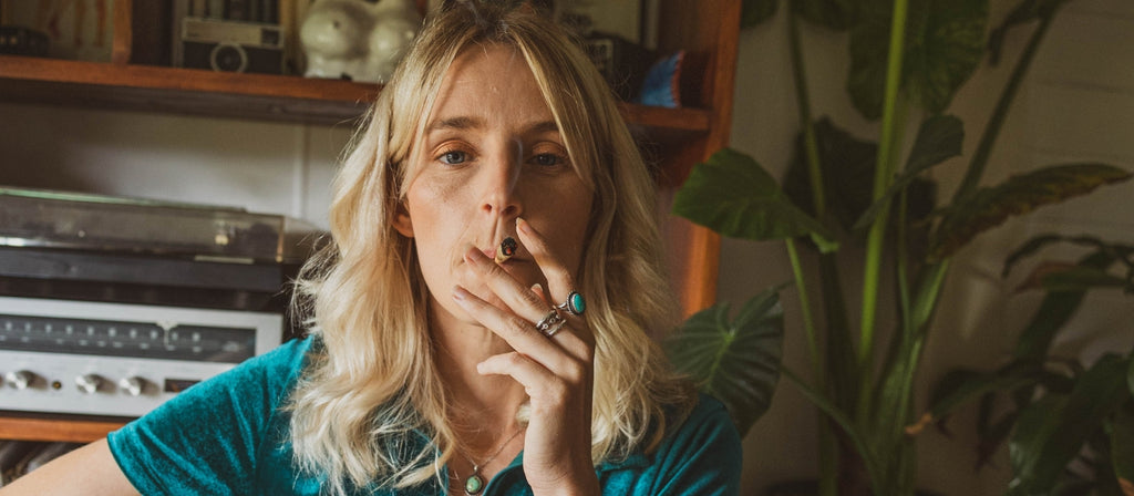Woman smoking a pre-rolled joint