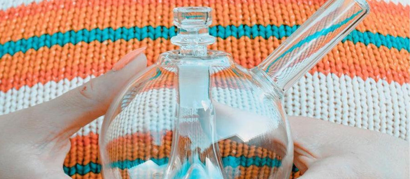 Woman holding GRAV Globe Bubbler Bong