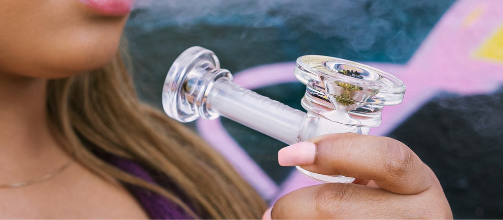 Woman holding a GRAV glass spoon pipe