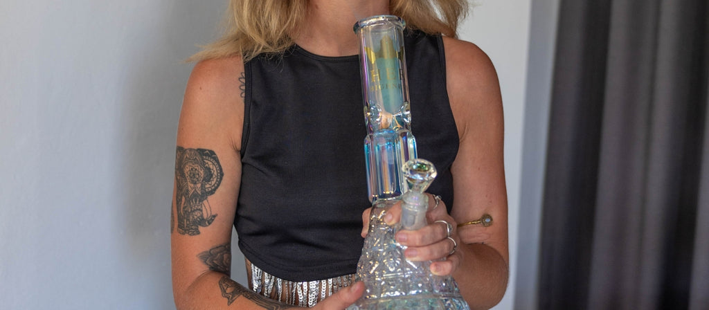 Woman holding a Her Highness glass bong