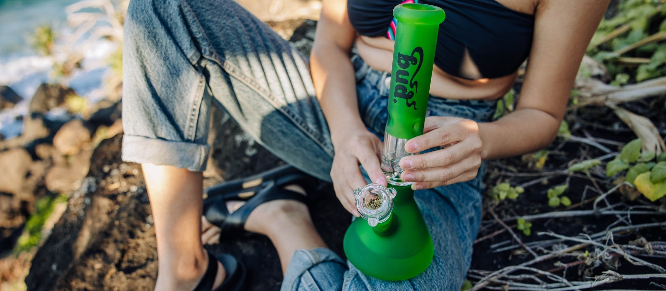 Woman holding green Bud Tree Percolator Glass Bong