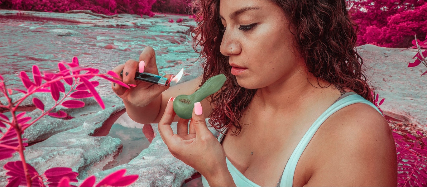 Woman lighting a GRAV glass spoon pipe