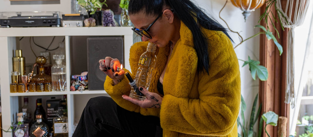 Woman smoking Gatorade bong