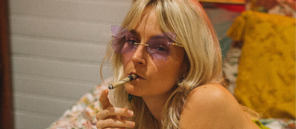 Woman smoking pre rolled cone